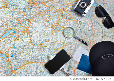 Travel plan, trip vacation accessories for trip, tourism mockup - Outfit of traveler on map background. Flat lay and copyspace. Travel plan, trip vacation accessories for trip, tourism mockup - Outfit of traveler on map background. Flat lay and copyspace. 87973496
