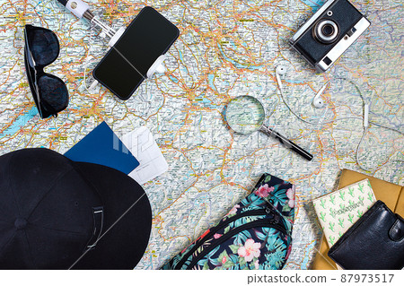 Travel plan, trip vacation accessories for trip, tourism mockup - Outfit of traveler on map background. Flat lay and copyspace. 87973517