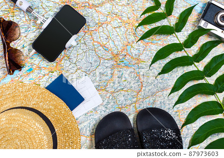 Travel plan, trip vacation accessories for trip, tourism mockup - Outfit of traveler on map background. Flat lay and copyspace. Travel plan, trip vacation accessories for trip, tourism mockup - Outfit of traveler on map background. Flat lay and copyspace. 87973603