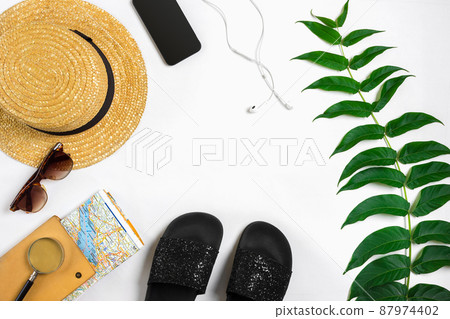 Travel accessories set on white background: smart, headphones, hat, map and sunglasses. Top view point. 87974402