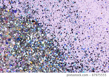 Holographic confetti on pastel pink purple background. Festive concept. High quality photo. Holographic confetti on pastel pink purple background. Festive concept. High quality photo. 87975555
