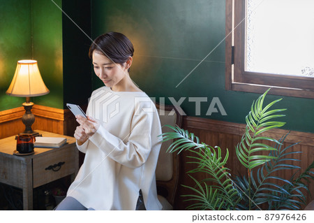 Middle women, smiles, smartphones Middle women, smiles, smartphones 87976426