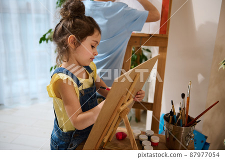 Art class. Adorable children paint on canvas. The concept of hobbies, art, creativity and children's entertainment 87977054