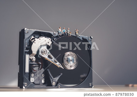 Workers having a break on top of giant HDD 87978030