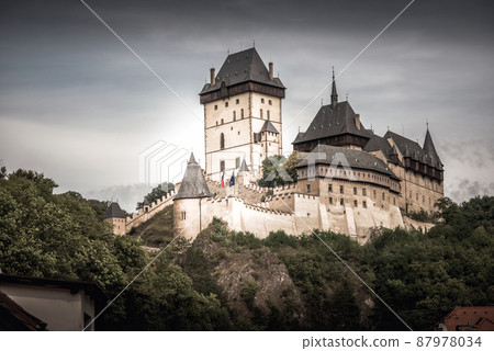 View of Karlstein Castle, a large Gothic castle founded in 1348 by King Charles IV. Karlstein village, Central Bohemia, Czech Republic 87978034