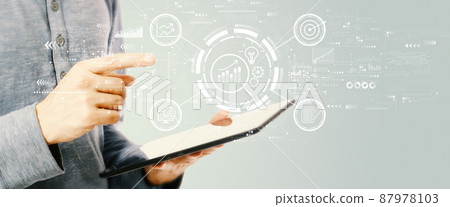 Data Analysis concept with young man holding a tablet 87978103