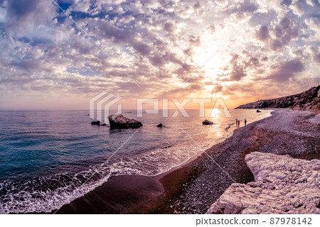Silhouettes at sunset near Petra tou Romiou. Paphos District, Cyprus 87978142