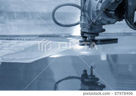 The multi-axis waterjet cutting machine cutting the aluminum plate. 87978406