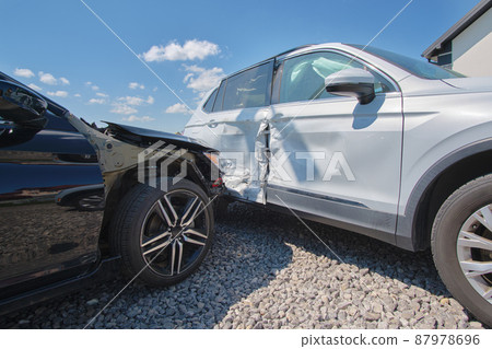 Cars crashed heavily in road accident after collision on city street. Road safety and insurance concept Cars crashed heavily in road accident after collision on city street. Road safety and insurance concept 87978696