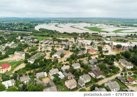 Aerial view of flooded houses with dirty water of Dnister river in Halych town, western Ukraine. 87979355