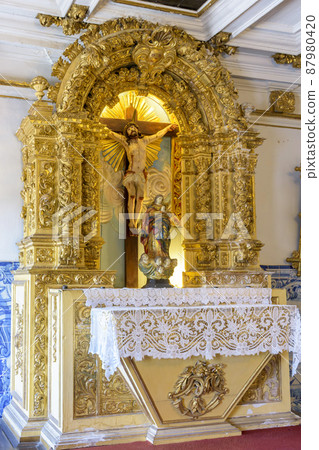 Altar of ancient and historic baroque church gold leaf with the image of Jesus Christ 87980420
