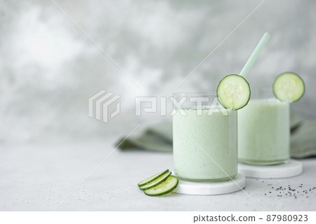 chilled cucumber and microgreen soup with kefir in large glasses 87980923