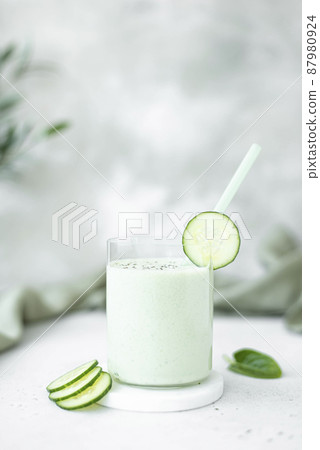 chilled cucumber and microgreen soup with mint in large glasses 87980924