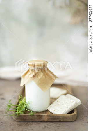 homemade natural ayran in glass bottles with microgreens 87980933