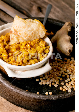 Traditional indian yellow pea food dal with roti bread 87981027