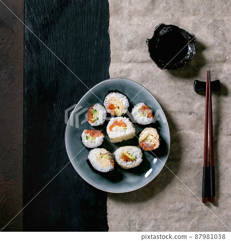 Homemade sushi rolls set with salmon, japanese omelette, avacado and soy sauce Homemade sushi rolls set with salmon, japanese omelette, avacado and soy sauce 87981038