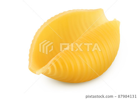 Uncooked dried conchiglie. Raw organic shell pasta isolated on white bachground with clipping path and full depth of field Uncooked dried conchiglie. Raw organic shell pasta isolated on white bachground with clipping path and full depth of field 87984131