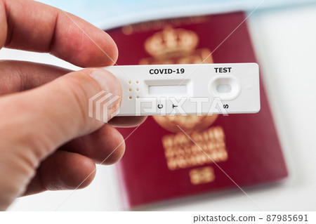 Person holding COVID-19 serological rapid diagnostic test Person holding COVID-19 serological rapid diagnostic test 87985691