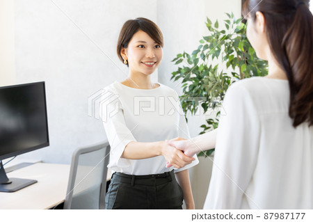 Business woman shaking hands Business woman shaking hands 87987177