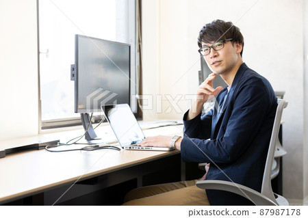 Men working in coworking space Men working in coworking space 87987178