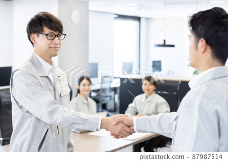Designer shaking hands Designer shaking hands 87987514