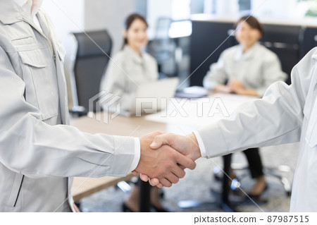 Designer shaking hands Designer shaking hands 87987515