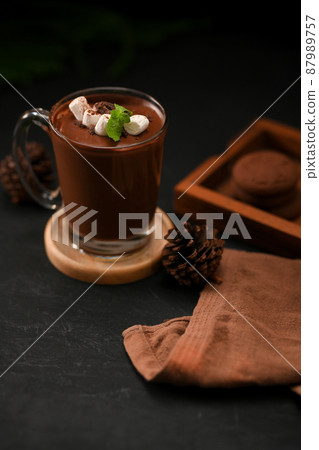 Dark chocolate or cocoa with marshmallow in a clear glass Dark chocolate or cocoa with marshmallow in a clear glass 87989757