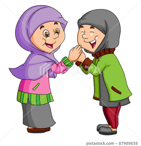 The two girls are celebrating the eid al fitr with the happy expression The two girls are celebrating the eid al fitr with the happy expression 87989838