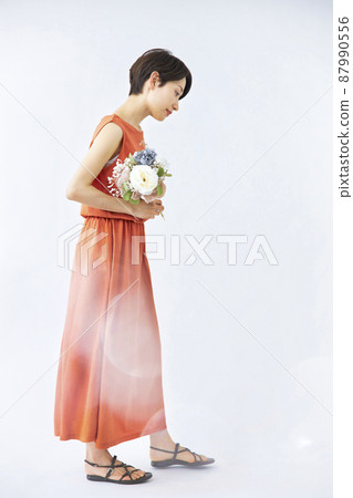 Female cool beauty with a bouquet 87990556