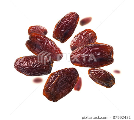 Dried dates levitate on a white background 87992481