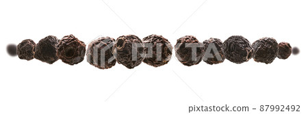 Dried hawthorn berries levitate on a white background Dried hawthorn berries levitate on a white background 87992492