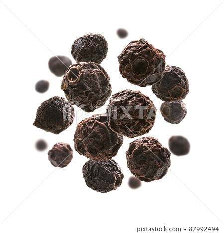 Dried hawthorn berries levitate on a white background 87992494