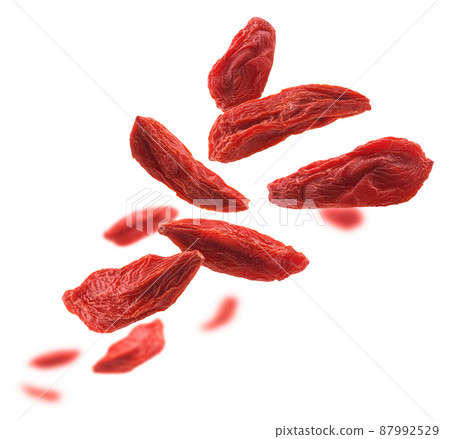 Dry Goji berries levitate on a white background Dry Goji berries levitate on a white background 87992529