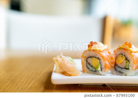 salmon roll sushi with cheese on top 87993100