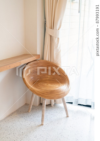 wood chair on corner in a room 87993191