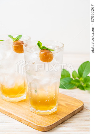 iced plum juice with soda and peppermint iced plum juice with soda and peppermint 87993267