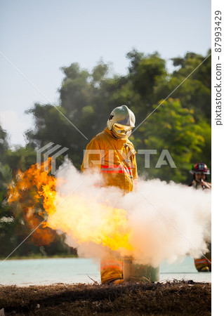 Firefighter with fire and suit for protect fire fighter for training firefighters. 87993429