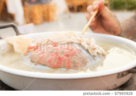 Sliced medium rare beef on a hot pan, thai barbecue 87993926