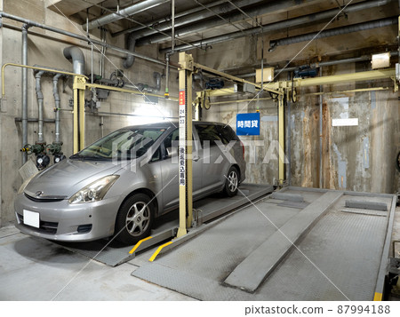 Mechanical parking lot in the basement of the building Mechanical parking lot in the basement of the building 87994188