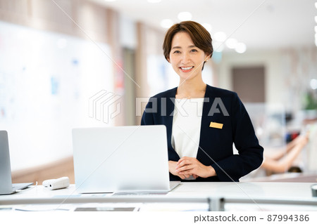 Woman at reception Woman at reception 87994386