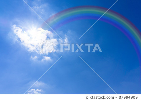 Rainbow over the blue sky and white clouds_45 87994909