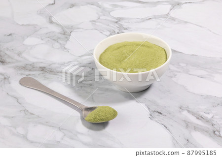 matcha green tea powder powder in a white bowl matcha green tea powder powder in a white bowl 87995185