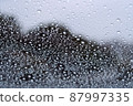 Material for rainy days in the outside view seen through the glass with raindrops 87997335