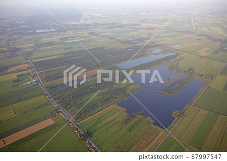 Agricultural landscape of Friesland, one of the northern provinces of the Netherlands - Friesland from above 87997547