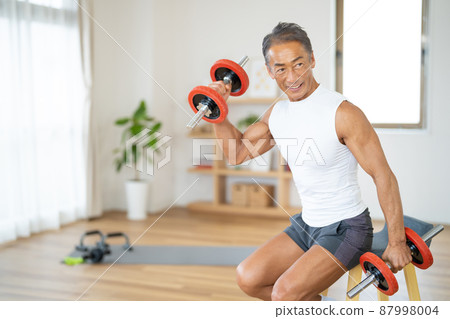 Senior male bodybuilder doing muscle training 87998004