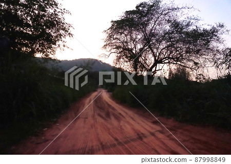 Countryside road with mountain background Countryside road with mountain background 87998849