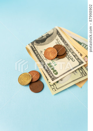 International currency money including euro, dollar, coin, dollar bill. Close-up. 87998902