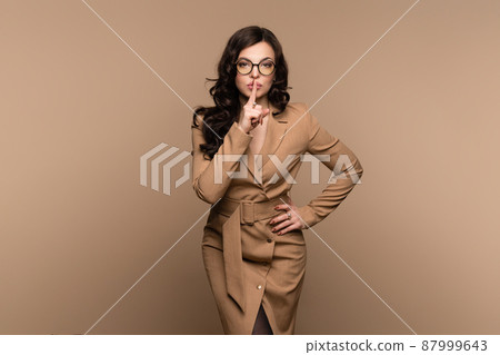 Girl makes sign of silence 87999643