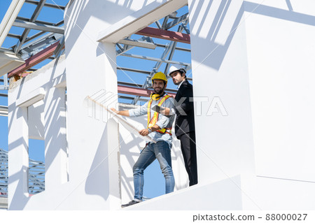 Architectural engineer meeting and working with blueprints at construction site,discussing,designing Architectural engineer meeting and working with blueprints at construction site,discussing,designing 88000027
