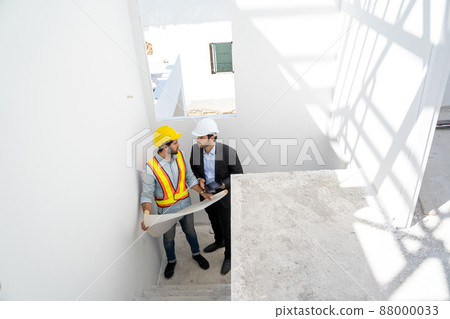 Architect and foreman meeting at construction site,Architect inspects the construction site. Architect and foreman meeting at construction site,Architect inspects the construction site. 88000033